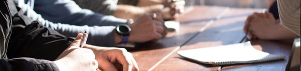 Meeting, hands on table, unsplash.com